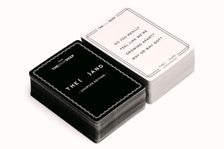 Black and white card game box with cards on a white background