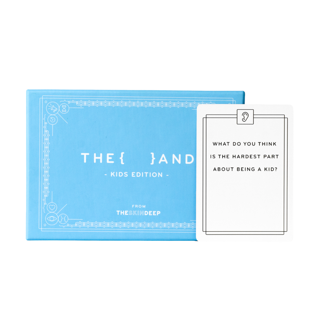 A kids' card game set shown with a bright blue box labeled 'THE { } AND - KIDS EDITION -' and a white card that reads 'WHAT DO YOU THINK IS THE HARDEST PART ABOUT BEING A KID?' on a clean white background.